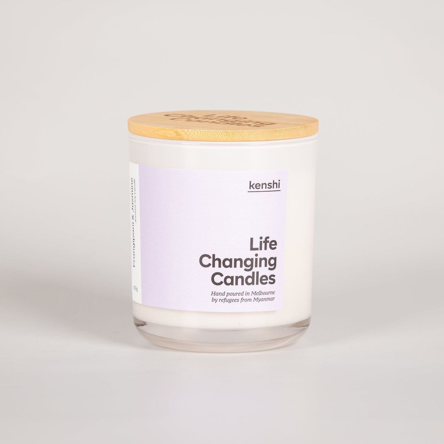 Glass candle labelled 'life-changing candles'